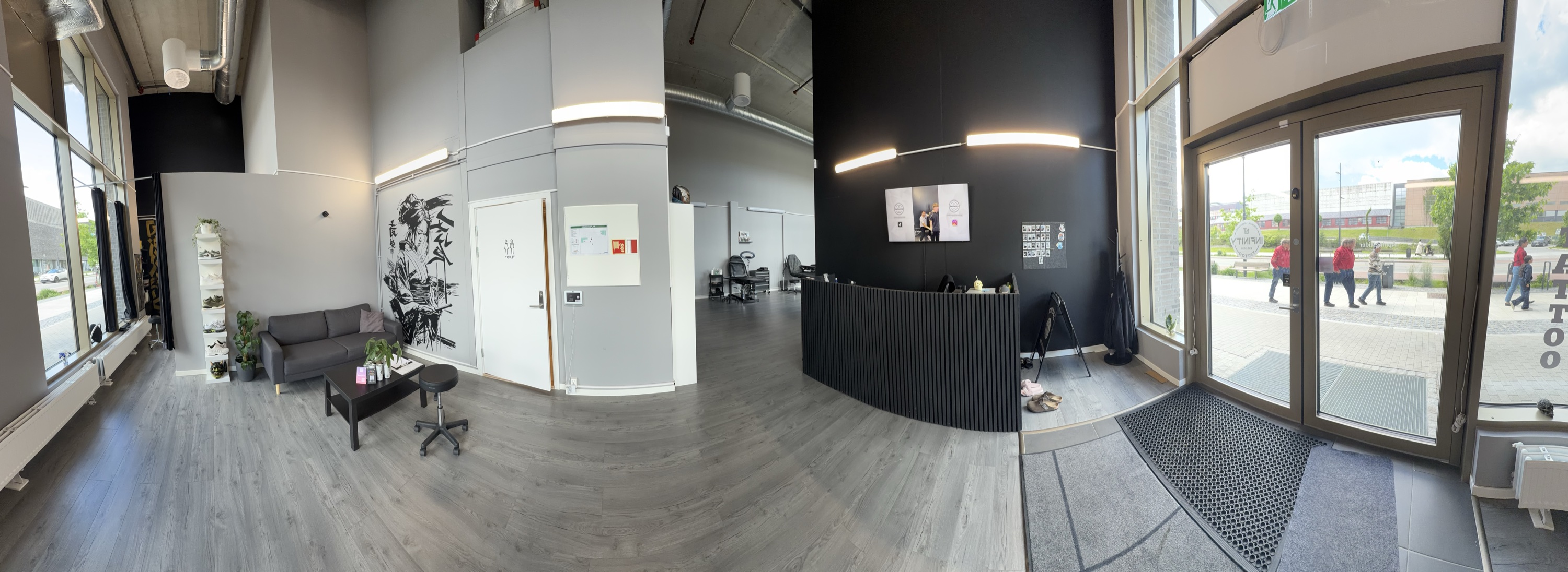 Panoramic interior view of Infinity Tattoo Studio
